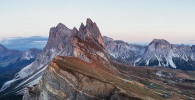 Cloudly weather. Outstanding landscape of the majestic Seceda dolomite mountains at daytime. Panoramic photo