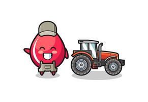 la mascota del granjero de la gota de sangre de pie junto a un tractor
