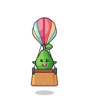 avocado mascot riding a hot air balloon vector