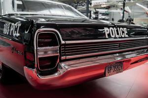 SINSHEIM, GERMANY - OCTOBER 16, 2018 Technik Museum. Numbers and inscriptions. Backing part of the police car that standing on white tile at vehicle exhibition photo