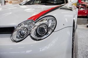 SINSHEIM, GERMANY - OCTOBER 16, 2018 Technik Museum. Sport car captured from the front. Headlights and perfect polished surface photo