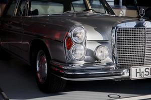 STUTTGART, GERMANY - OCTOBER 16, 2018 Mercedes Museum. In the shadows. Silver colored retro car captured from the front photo