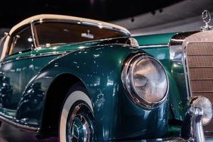 STUTTGART, GERMANY - OCTOBER 16, 2018 Mercedes Museum. Close up view of the front of green vintage car photo