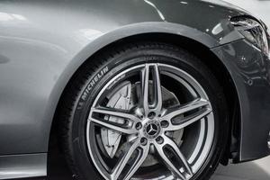 STUTTGART, GERMANY - OCTOBER 16, 2018 Mercedes Museum. Right front wheel of the silver modern car photo