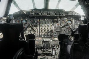 SINSHEIM, GERMANY - OCTOBER 16, 2018 Technik Museum. Blurred front glass. Old analog cockpit of the plane. Inside near pilot seats photo