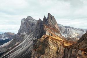 Dangerous slopes. Outstanding hills of the Seceda dolomite mountains at daytime photo