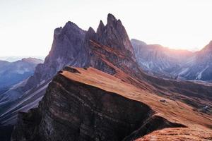 On the Seceda dolomites in Italy. Breathtaking moment of the evening sunset photo