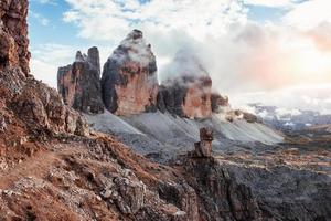 Good weather. Mountains in the fog and clouds. Tre Cime di Lavaredo