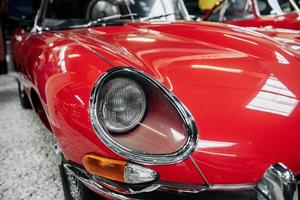 SINSHEIM, GERMANY - OCTOBER 16, 2018 Technik Museum. Front of the red vintage luxury car standing indoors at exhibition photo