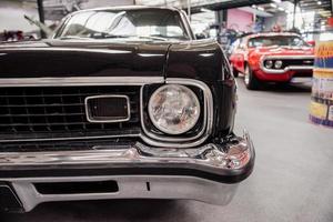 SINSHEIM, GERMANY - OCTOBER 16, 2018 Technik Museum. Headlights and front part of luxury black vintage automobile photo