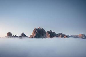 Beautiful shadows. The peaks of the mountains stifle from a going thick fog. Unbelievable photo takes