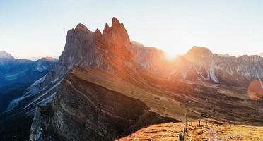Gorgeous sunset. Outstanding landscape of the majestic Seceda dolomite mountains at daytime. Panoramic photo
