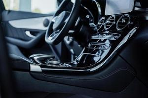 Gorgeous lighting. Inside of the modern car. Steering wheel and front instruments photo