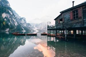 Ground view. Good landscape with mountains. Touristic place with wooden building and pear photo