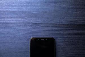 Frameless mockup smartphone on office desk. Copy space. Empty space for text. Top view photo