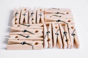 Wooden clothespins on a white background. View from above photo