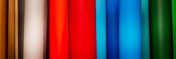 Vinyl self-adhesive film for advertising banners printing. Multi-colored roll. photo