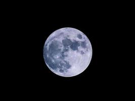 Full moon view in dark night sky photo