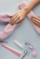 close up manicurist holding customer hand. High quality beautiful photo concept