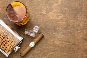 top view whiskey with orange cigar with copy space photo