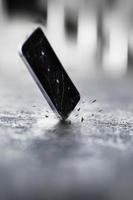 Smartphones falling and crashing on the ground photo