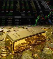 Gold bullion on the coin at trading chart background photo