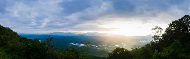 Landscape sunrise over mountains and warm morning sun photo