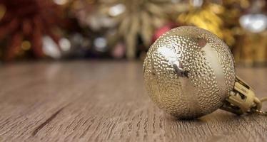 Christmas bal on wooden floor for  christmas background photo