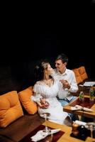 guy and a girl have lunch in a cafe photo