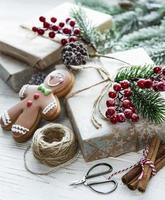 Christmas background with gift boxes and gingerbread cookies. photo