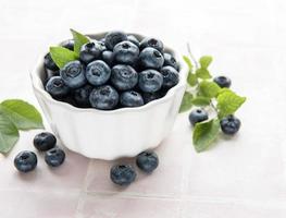 Blueberries on tile background photo