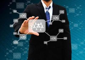 Businessman holding icon of social network photo