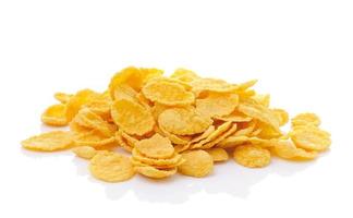 Sweet, tasty cornflakes, dry crispy on white background photo