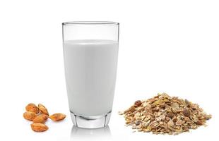 fresh milk in the glass almond and muesli breakfast placed on white background photo