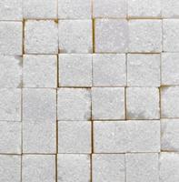 white sugar cubes texture background photo