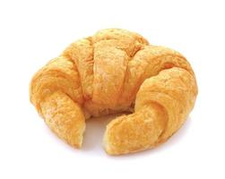 Fresh and tasty croissant over white background photo