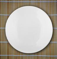 white empty bowl on a bamboo table photo