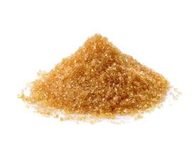 Brown sugar on white background photo