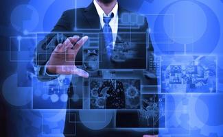 businessman holding Reaching images streaming in hands .Financial and technologies concepts photo