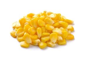 Sweet whole kernel corn on white background photo