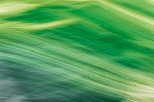 Green-yellow abstract background. Imitation of mountain grass covered hills. photo