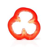 red pepper slices on white background photo