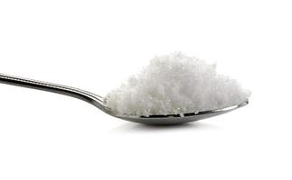 sea salt in spoon on white background photo