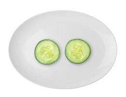 Cucumber in the white plate isolated on white background