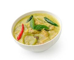 Thai food chicken green curry in the white bolw on white background photo