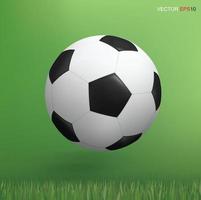 Balón de fútbol sobre fondo de área de césped verde. vector. vector