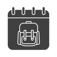 September 1st glyph icon. Silhouette symbol. Calendar page with student's backpack. Negative space. Vector isolated illustration