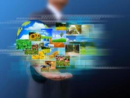 businessman holding green Earth in hands and Reaching images streaming .Environmental concept photo