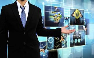 businessman holding Reaching images streaming in hands .Financial and technologies concepts photo