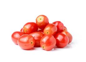 Plum tomatoes on white background photo